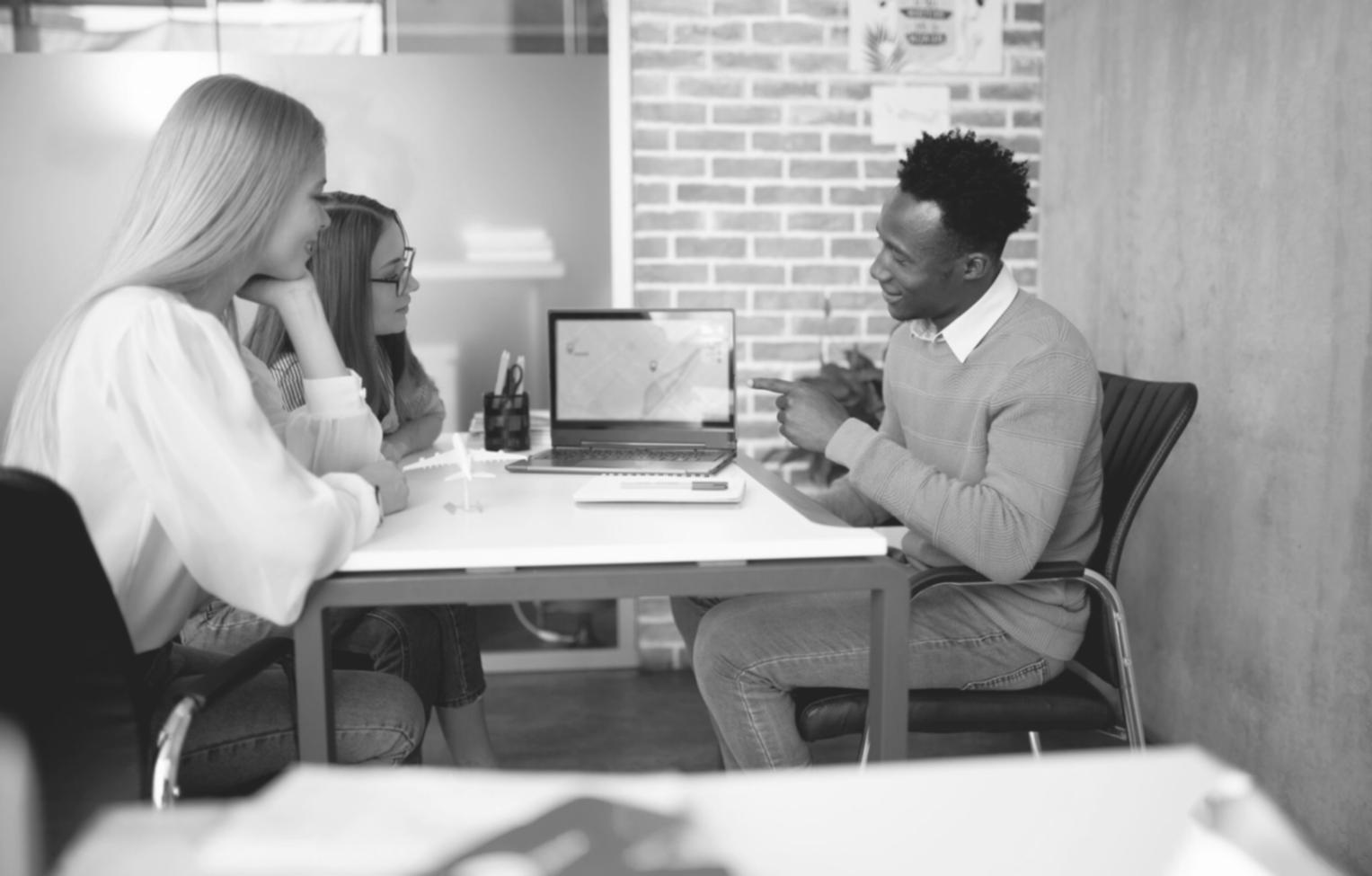 Business team reviewing financial reports and discussing strategies during training session